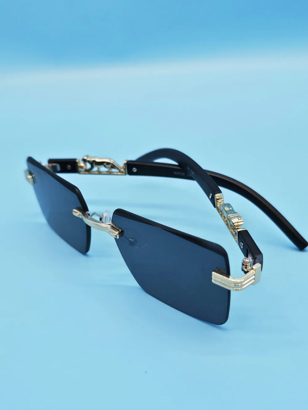 Men's Black and Gold Rimless Sunglasses